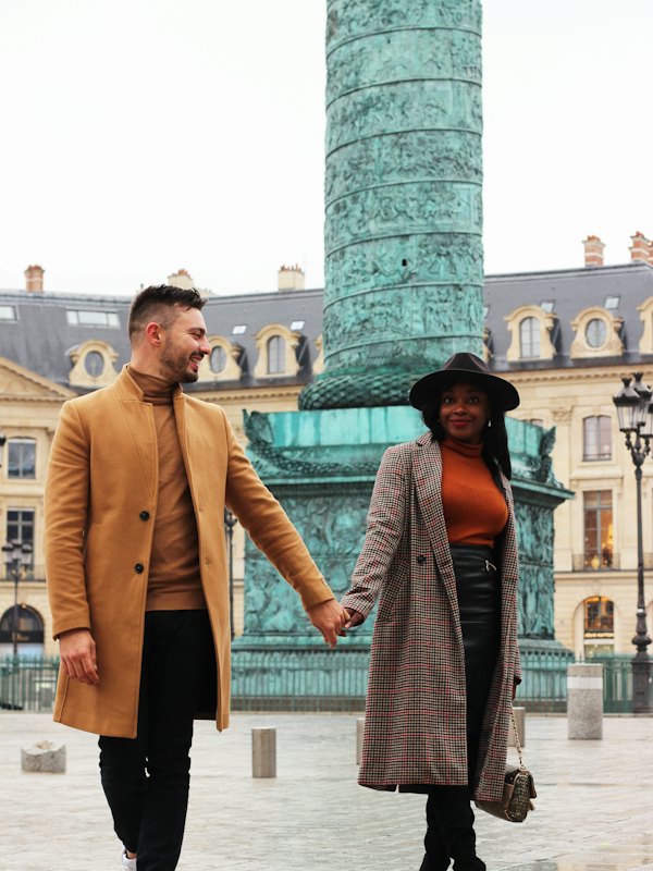 Couple walking in Paris, man in a camel coat