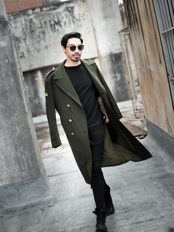 Man in a long olive coat